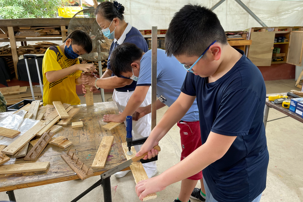 One of the many activities that the children got to try out was woodworking during a visit to Ground-Up Initiative (GUI), a non-profit organisation promoting sustainable living and a hands-on culture. (Photo by Hsu Che Wei)